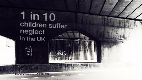 Tunnel showing text written on the wall.