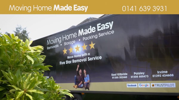 A moving van on a driveway.